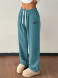 Teal wide-leg corduroy pants with elastic high waist, drawstring and fine-rib texture