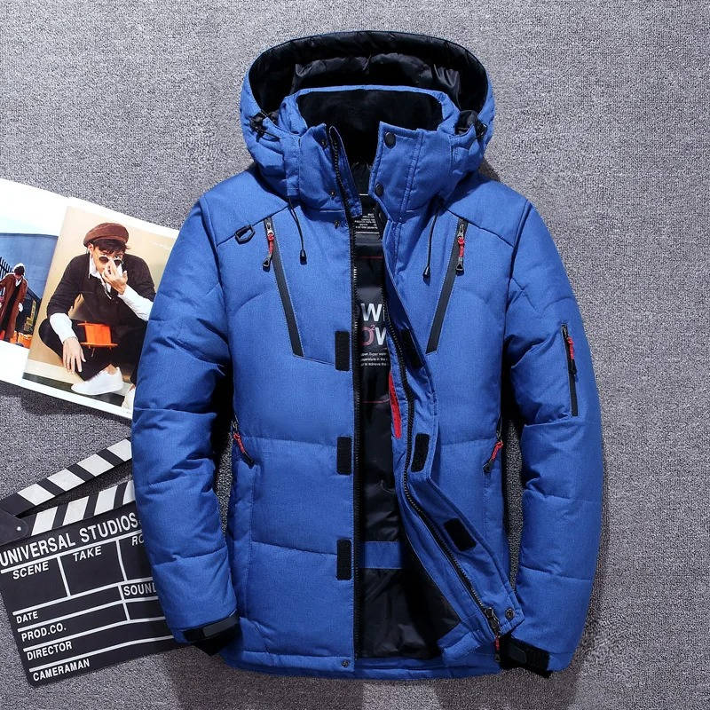 Blue duck down parka with adjustable hood, water-resistant nylon shell, and zippered pockets on a textured grey background.