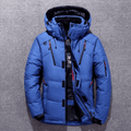Blue duck down parka with a water-resistant nylon shell, adjustable hood, and neoprene storm cuffs on a grey background.