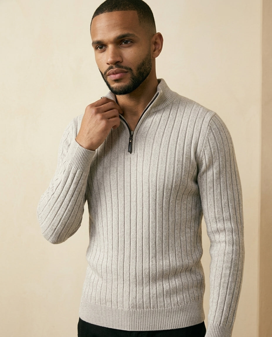 Light grey ribbed quarter zip sweater with a stand collar and regular fit, featuring broad vertical knit columns.