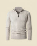 Beige ribbed quarter-zip sweater with a stand collar, vertical knit columns, and fitted trim bands on a neutral background.