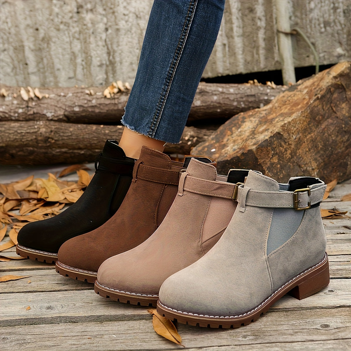 Napped suede Chelsea boots in black, brown, beige, and grey with buckle straps, elastic side panels, and lug soles.