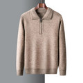 Mid-weight tan quarter-zip knit sweater with a folded point collar and ribbed cuffs, hanging on a wooden hanger.