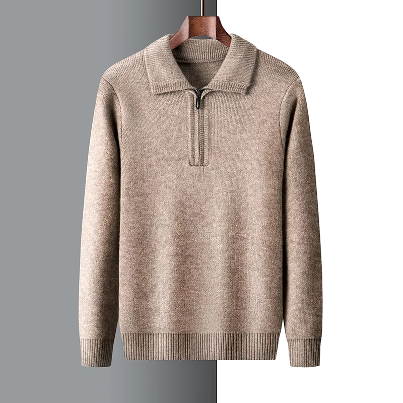 Mid-weight tan quarter-zip knit sweater with a folded point collar and ribbed cuffs, hanging on a wooden hanger.