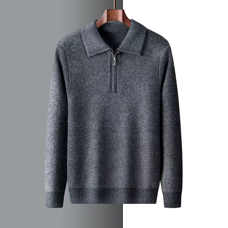 Charcoal grey mid-weight knit quarter-zip sweater with a folded point collar and ribbed cuffs on a wooden hanger.