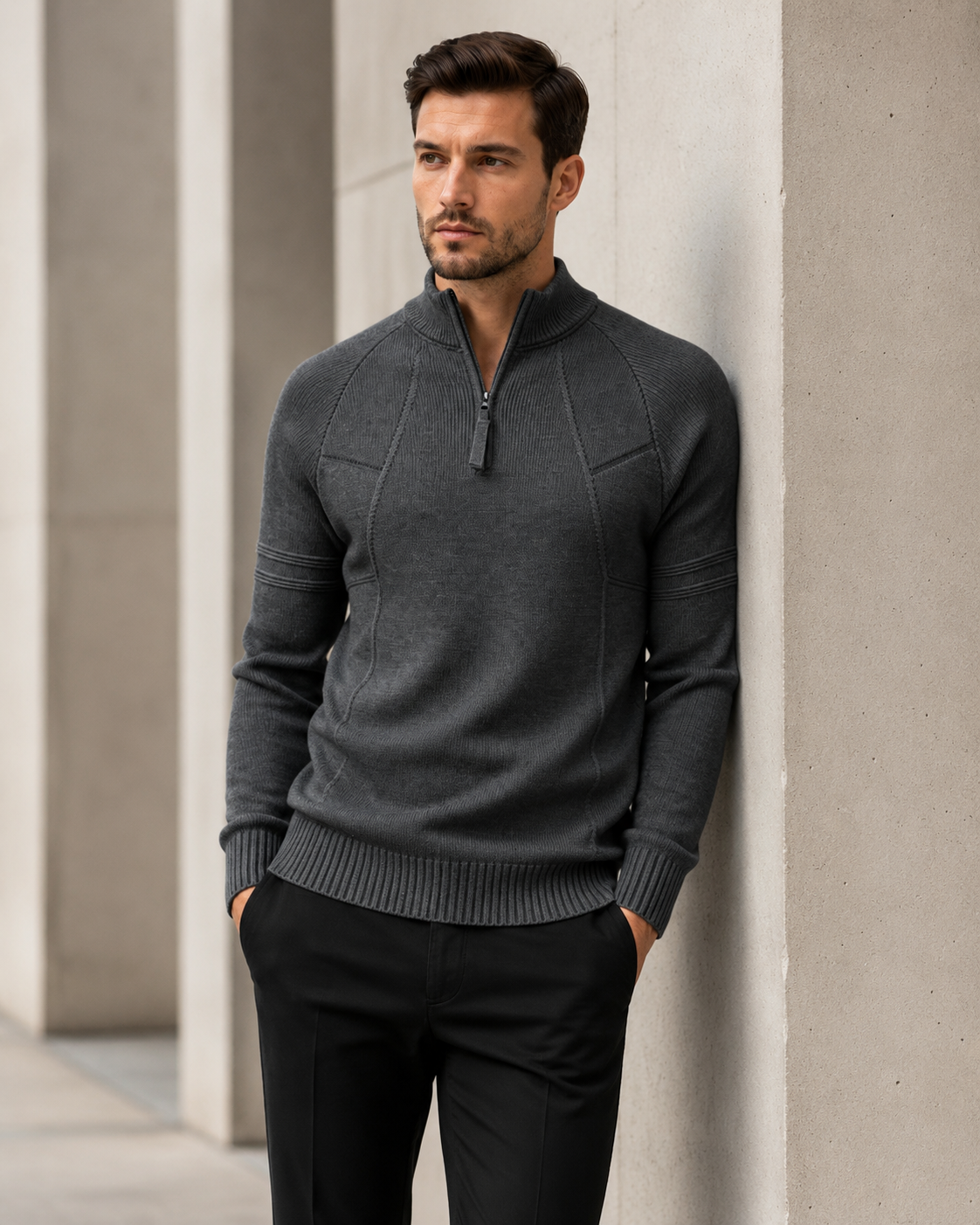 Fitted knit quarter-zip sweater worn by a male model in dark gray, front view