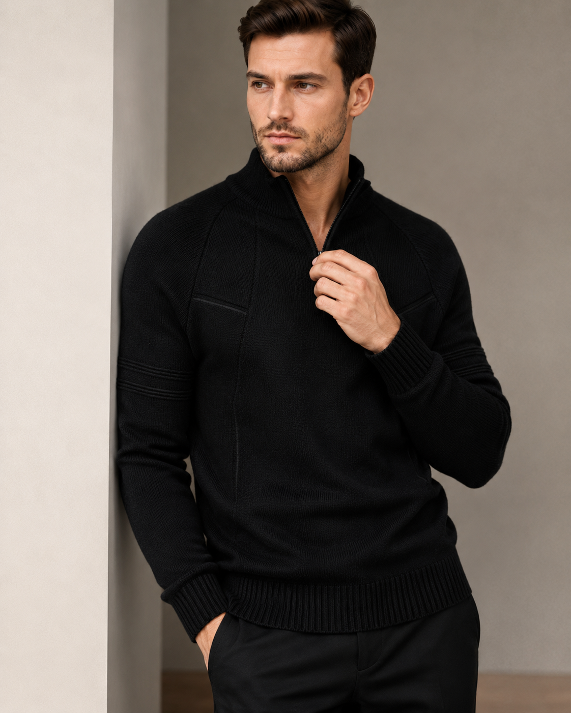 Black fitted quarter-zip sweater worn by male model, front view