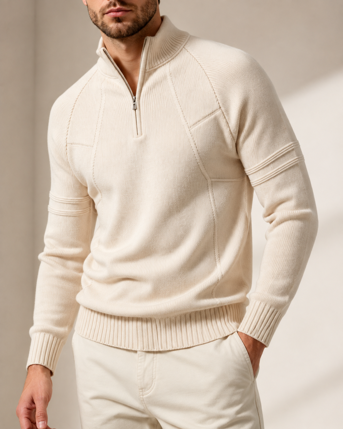 Fitted knit quarter-zip sweater worn by a male model in cream, front view