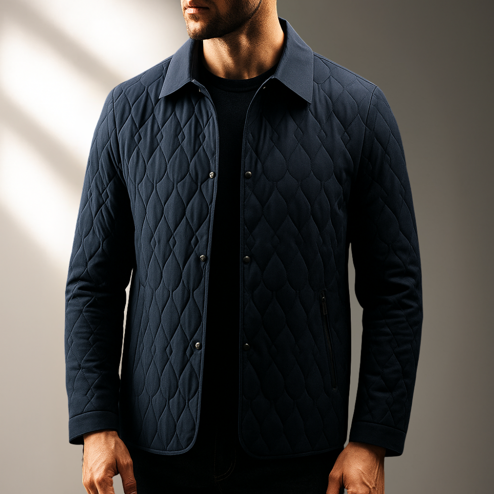 Navy blue diamond-stitch quilted jacket with a structured turn-down collar and button-front closure.