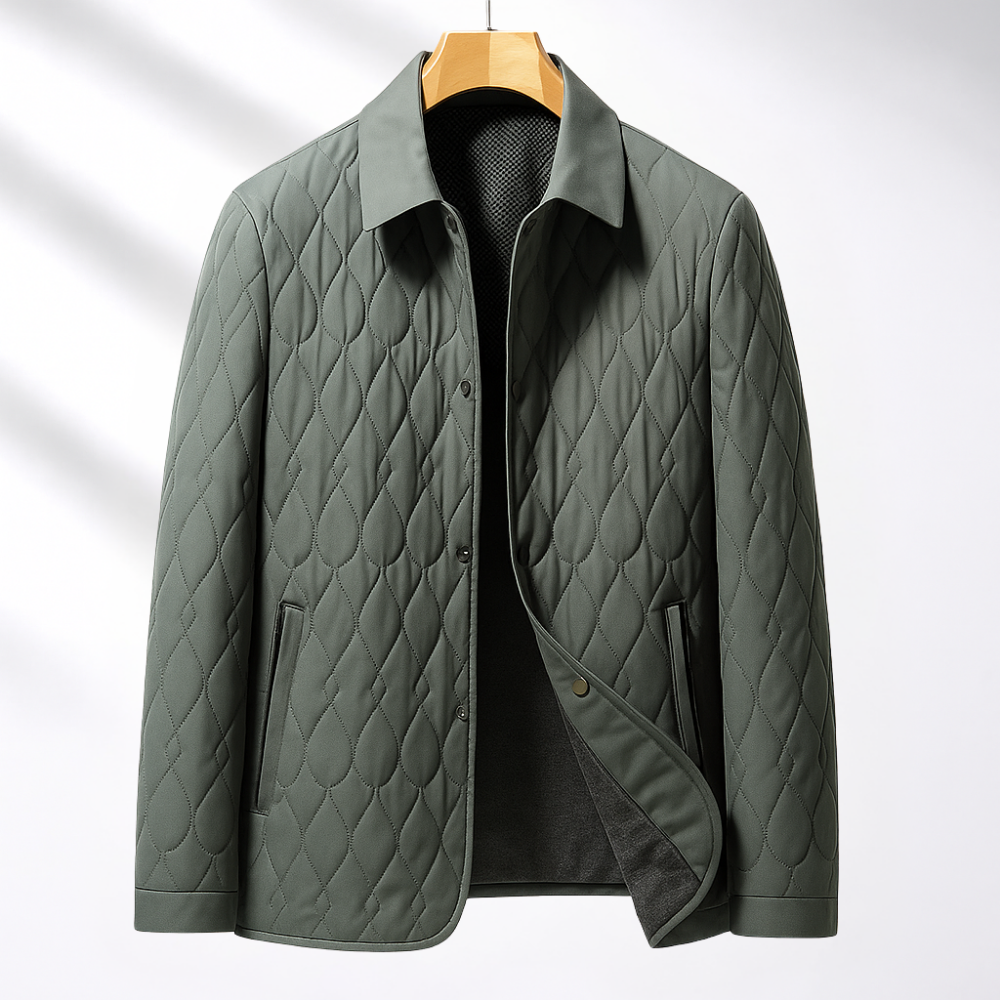 Sage green quilted jacket with diamond-stitch pattern, turn-down collar, and button-front closure on a wooden hanger.