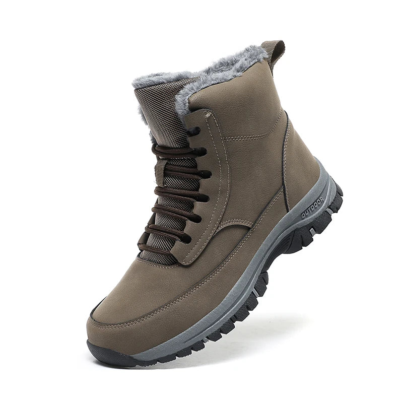 Man lacing up khaki fleece-lined ankle boots for men on wet pavement