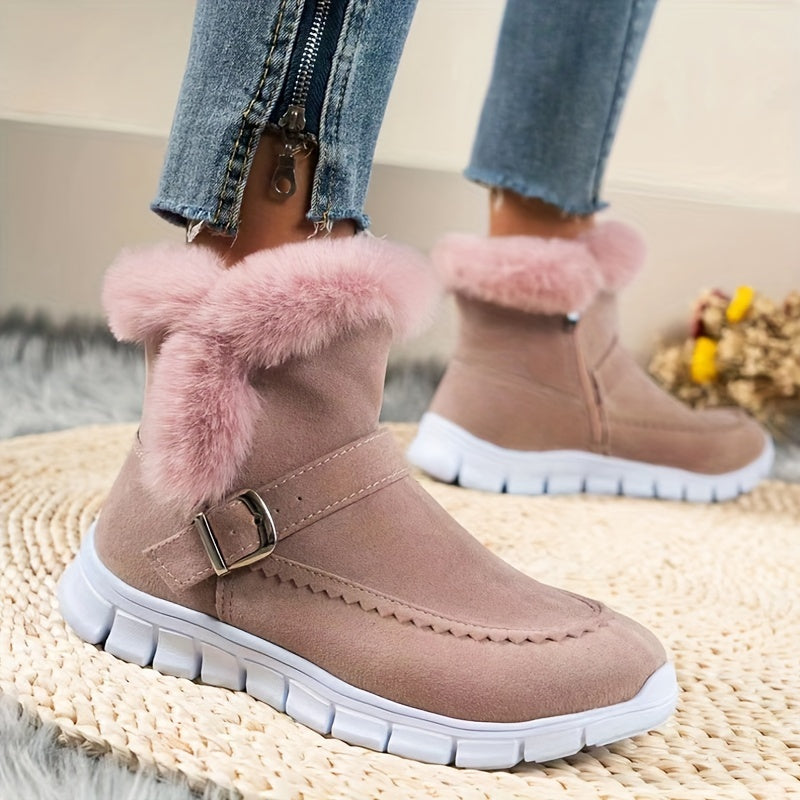 Pink faux fur trim ankle boots for women with buckle strap, worn with cropped jeans