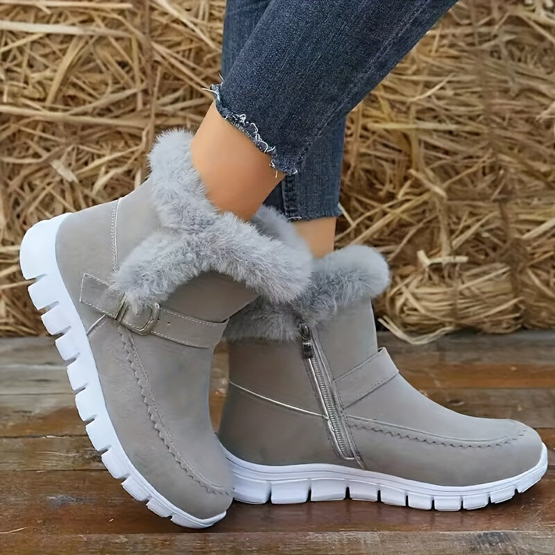 Gray suede-look fleece-lined ankle boots for women with fur cuff and side zip, worn with jeans