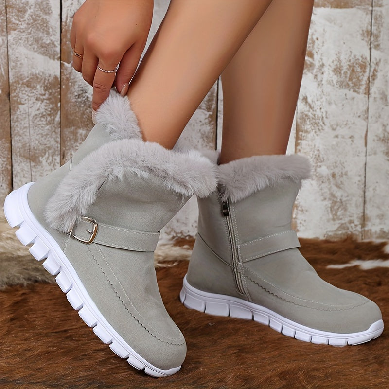 Close-up of gray fur-trim ankle boots for women with side zip and buckle strap at the ankle