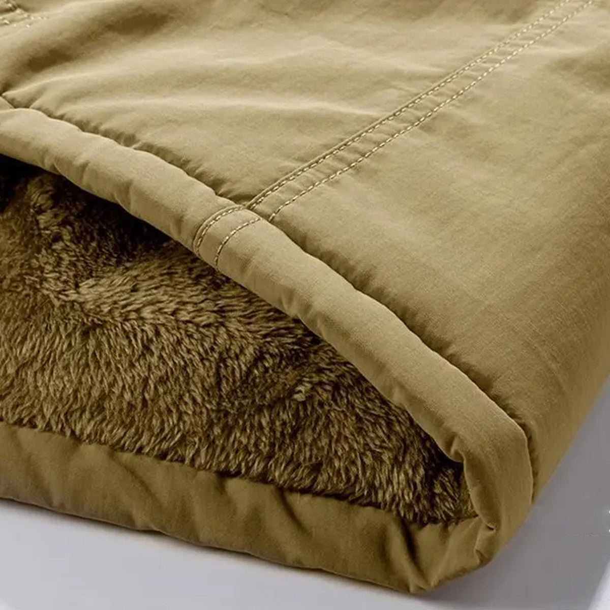 Khaki utility jacket featuring a durable cotton exterior and a plush, warm fleece lining with visible topstitching detail.