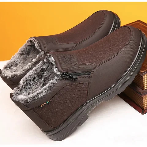 Dark brown winter boots featuring a plush gray fur lining, side zipper closure, and a durable traction-focused sole.