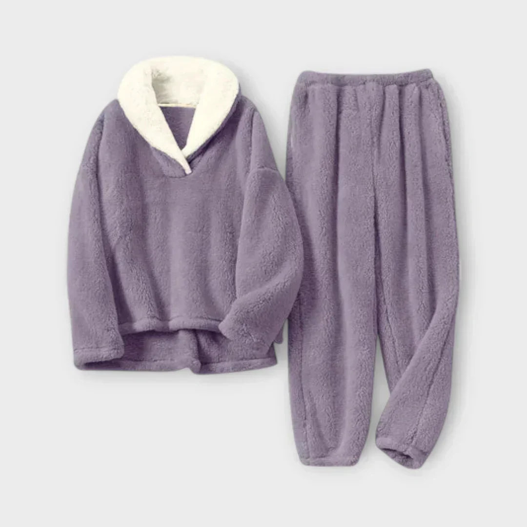 Product flat-lay view of the plush fleece lounge set in muted purple lavender with a cream white sherpa collar pullover and elastic-waist joggers.