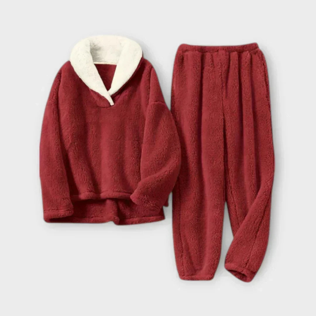 Product flat-lay view of the plush fleece lounge set in crimson red featuring a cream sherpa shawl collar pullover and matching fleece pants.