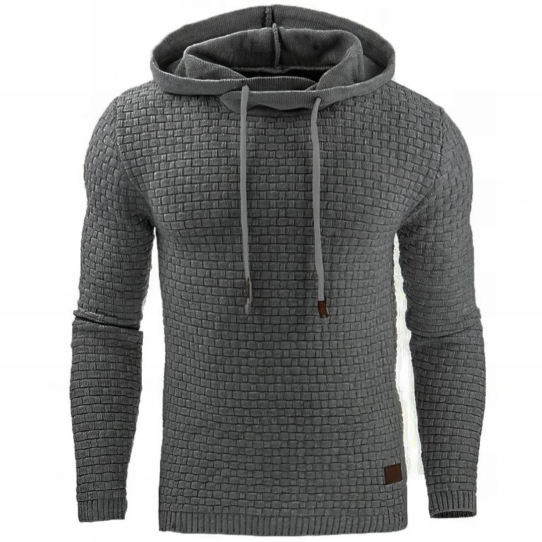 Gray textured waffle knit pullover hoodie featuring adjustable drawstrings, a relaxed fit, and long sleeves on a white background.