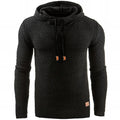 Black textured knit pullover hoodie with a waffle knit pattern, adjustable drawstrings, and long sleeves displayed on a white background.