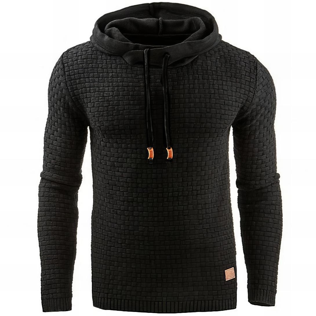 Black textured knit pullover hoodie with a waffle knit pattern, adjustable drawstrings, and long sleeves displayed on a white background.