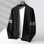 Black wool-blend V-neck cardigan with sleeve stripes, button front, and patch pockets on a white undershirt.