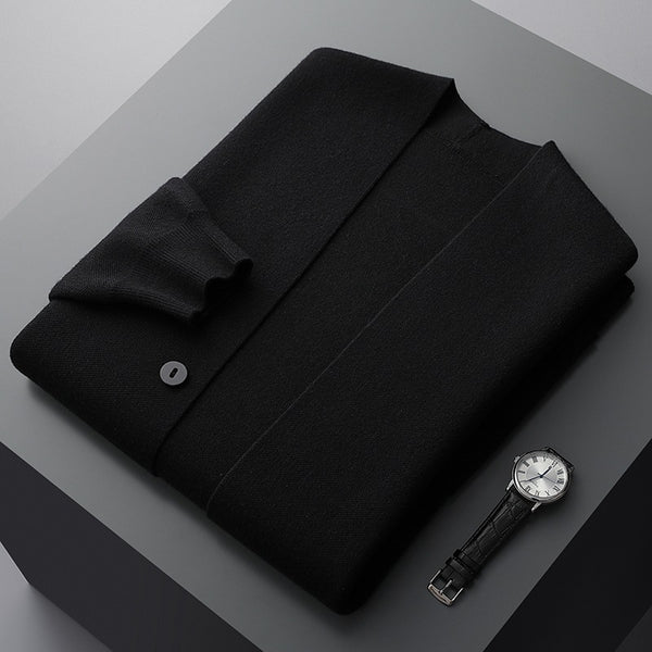 Black wool-blend V-neck cardigan with a tailored button-front, folded neatly beside a classic leather-strap watch.