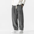 Gray gathered-cuff corduroy pants with wide legs, drawstring waist and slash pockets