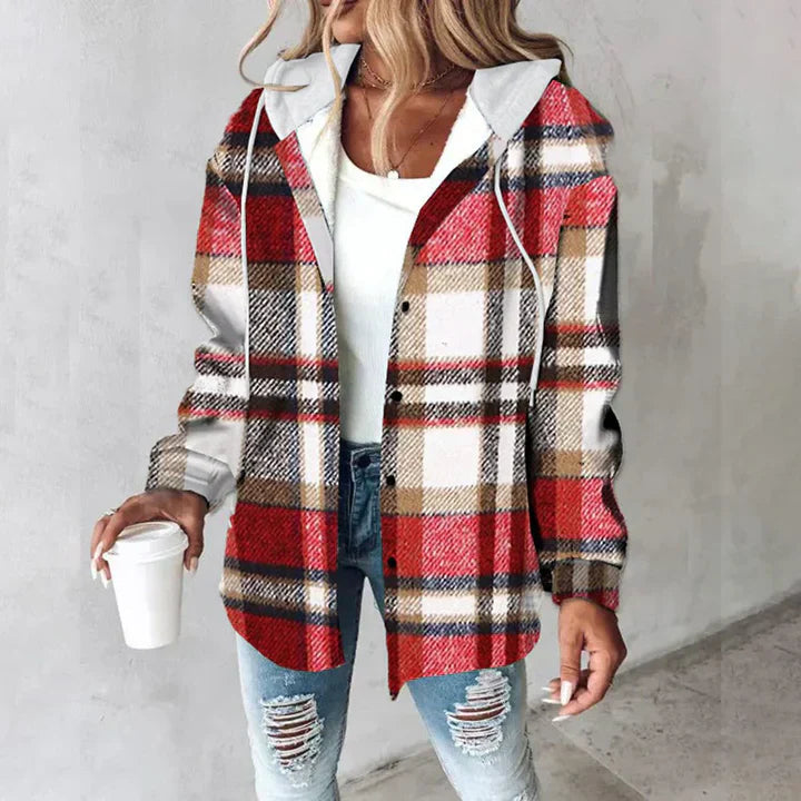 Red and white plaid flannel shacket with a soft sherpa lining, drawstring hood, and relaxed button-up fit.