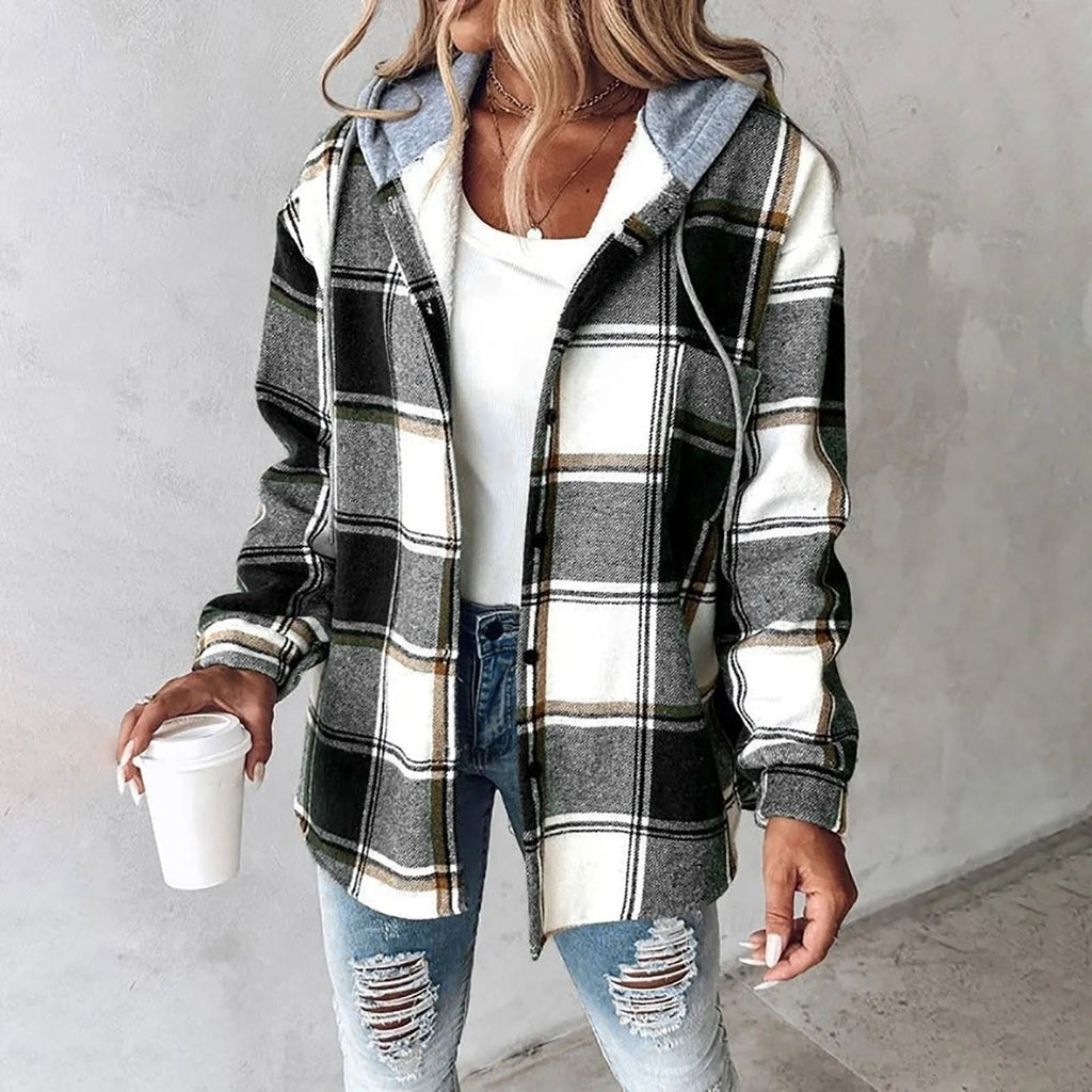 Green and white plaid flannel shacket with a grey drawstring hood, sherpa lining, and a relaxed button-up fit.