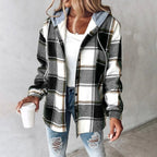 Green and white plaid flannel shacket with a grey drawstring hood, sherpa lining, and a relaxed button-up fit.
