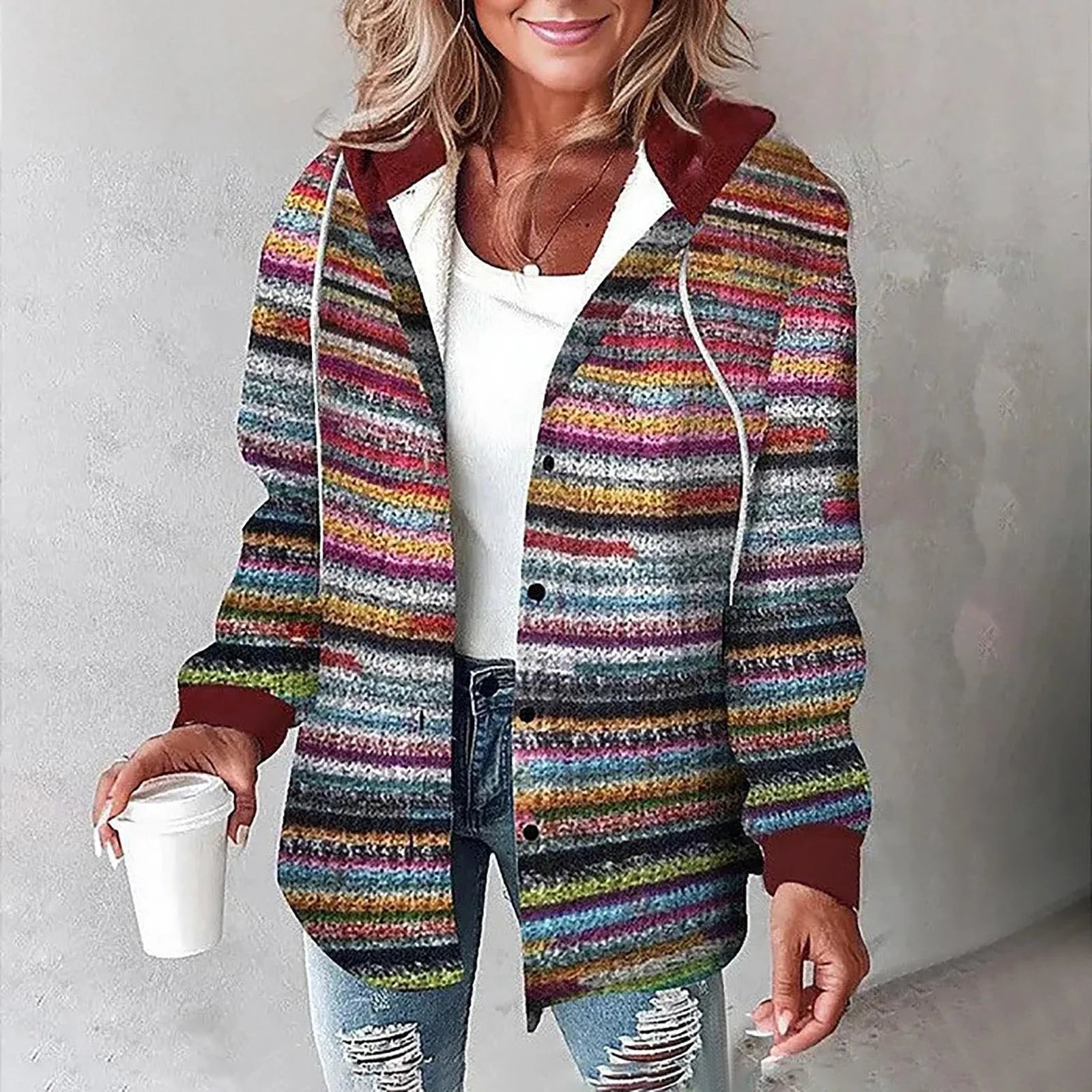 Multi-colored striped hooded shacket in soft flannel with a button-up front, drawstring hood, and relaxed fit.