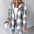 Grey and white plaid flannel hooded shacket with a soft sherpa lining and relaxed button-up fit.