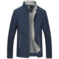 Navy zip-up jacket with a stand collar, plaid lining, zippered pockets, and long sleeves displayed on a white background.