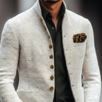 Off-white textured weave blazer with a stand collar, single-breasted button front, and a dark pocket square.