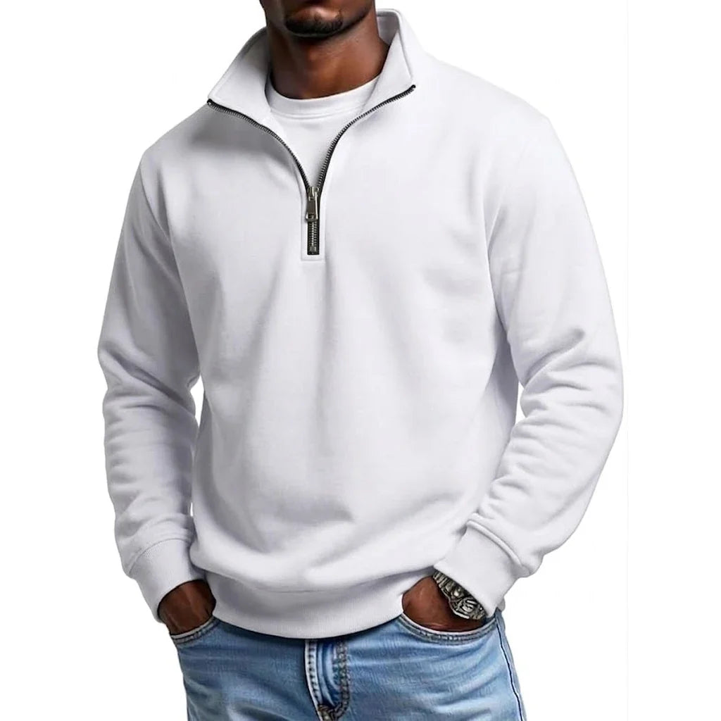 White quarter-zip fleece sweatshirt with a stand collar and long sleeves, paired with blue jeans for a clean casual style.