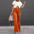High-waisted orange corduroy flare pants with a fitted thigh and button-zip fly, styled with a cropped white knit top.