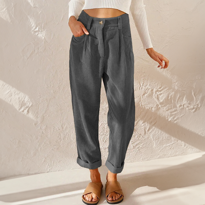 Charcoal gray high-waisted corduroy pants with front pleats, a relaxed tapered leg, and adjustable turn-up cuffs.