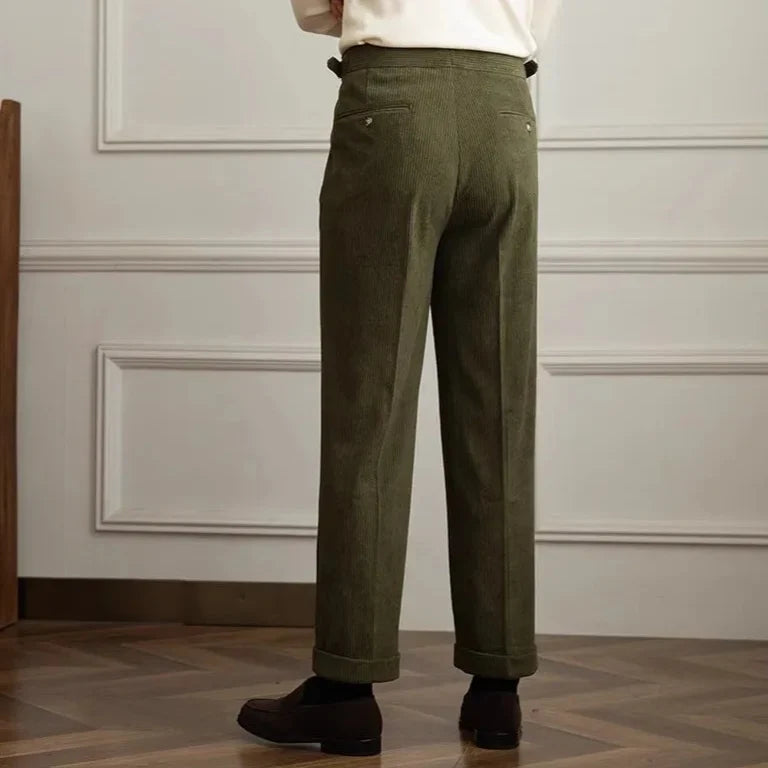 Olive green corduroy pants shown from the back with pleated wide-leg fit