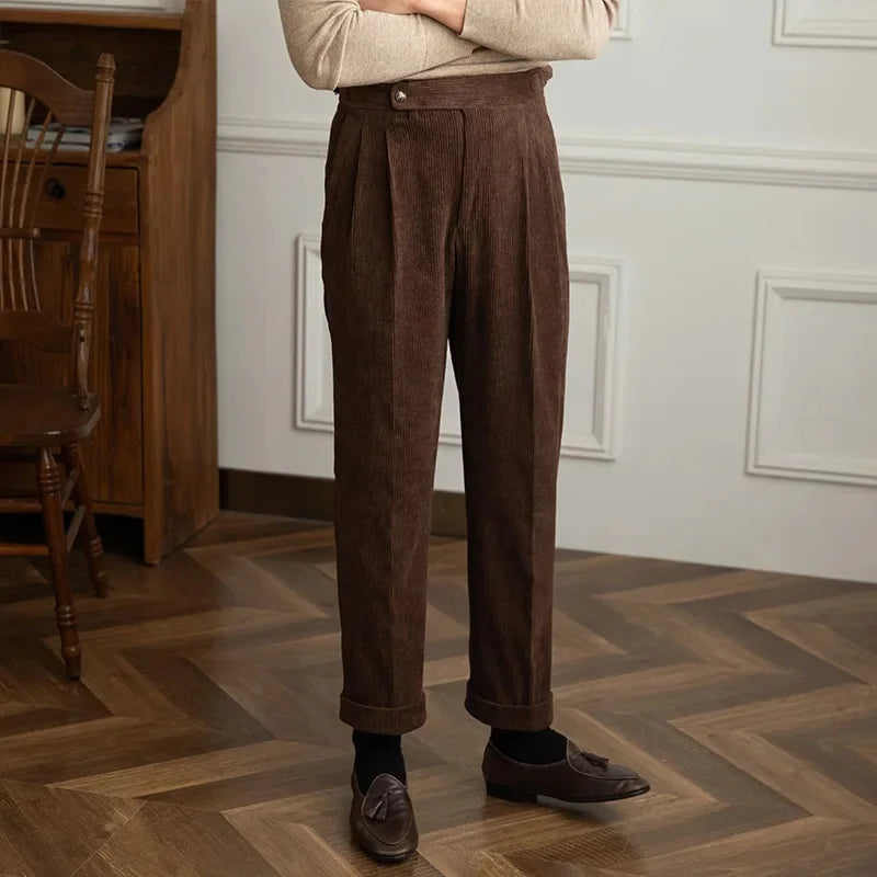 Brown high-waisted pleated corduroy pants with relaxed straight-leg fit