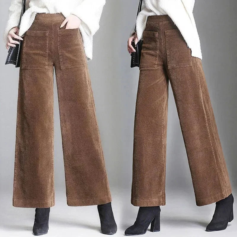 Brown high-waisted wide-leg corduroy pants with front patch pockets and full-length hem