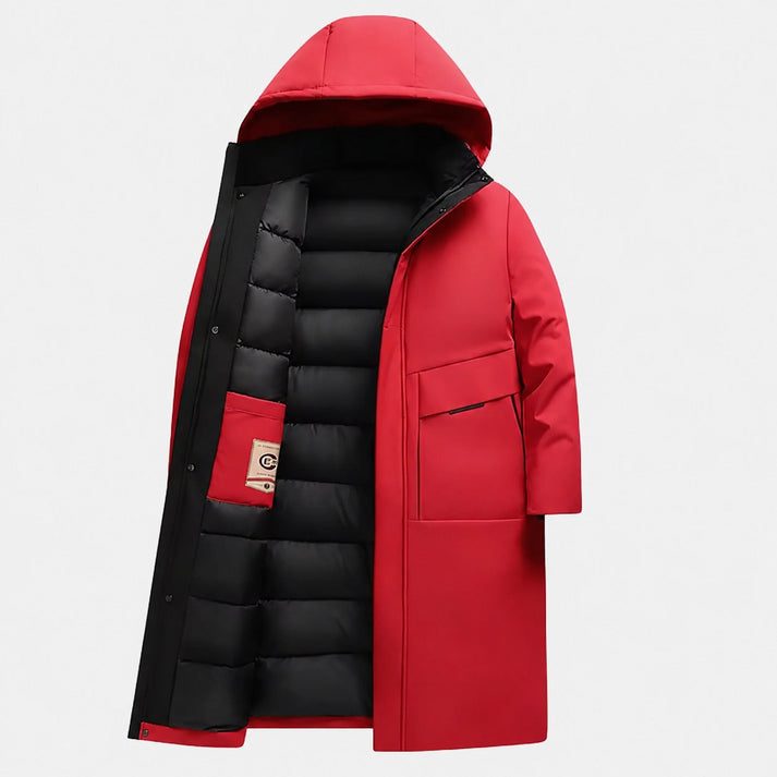 Red longline parka with a matte shell, attached hood, and black quilted interior padding featuring deep utility pockets.