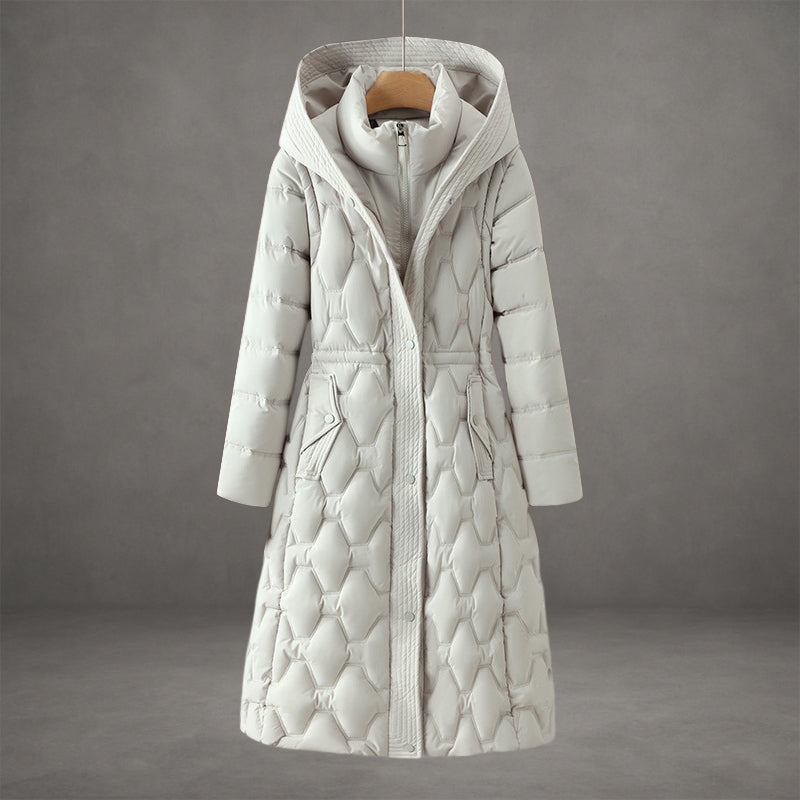 Off-white longline puffer coat with a hooded collar, insulated geometric quilting, and front pockets, hanging on a hanger.