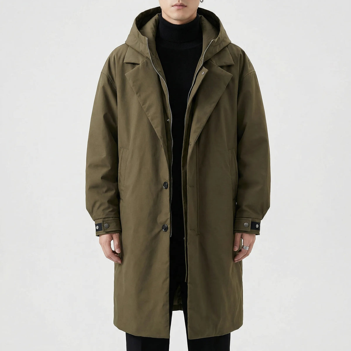 Olive green Hooded Padded Longline Trench Coat shown from the front, featuring notch lapels, hooded collar, zip-and-button front, padded design, and side pockets.