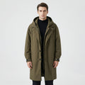 Olive green Hooded Padded Longline Trench Coat worn by a male model, highlighting the hooded collar, notch lapels, padded construction, and zip-and-button front.