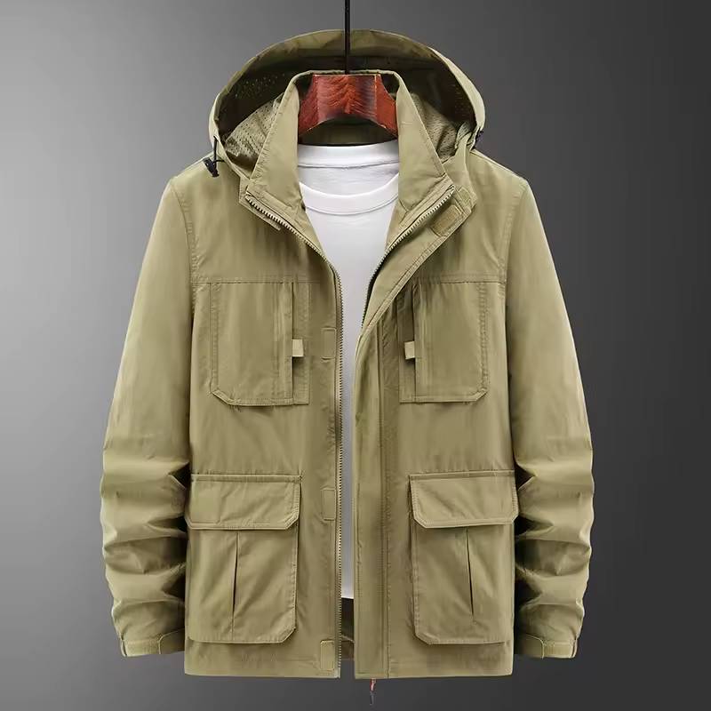 Front product layout view of the beige hooded utility jacket on a hanger displaying the open zipper, hood drawstrings, and four flap pockets over a white t-shirt.