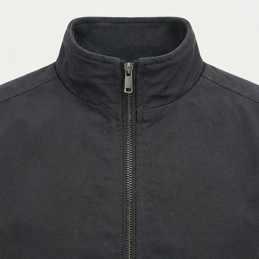 Close-up of the bomber jacket stand collar and front zipper showcasing the premium construction and smooth fabric.