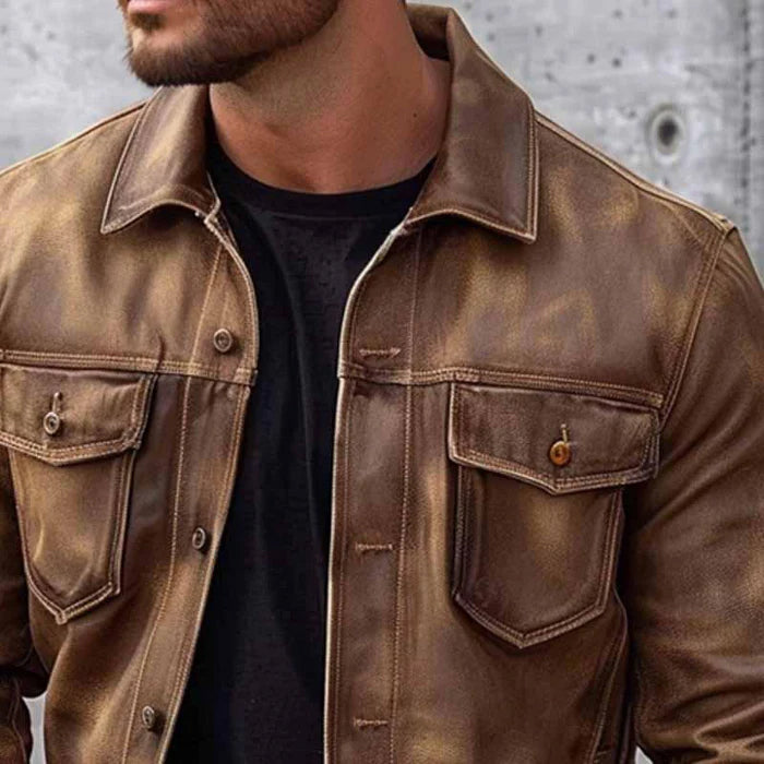 Distressed brown leather trucker jacket with a classic collar, button-up front, and dual chest flap pockets.