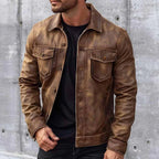 Distressed brown leather trucker jacket with a classic collar, button-up front, and dual chest flap pockets.