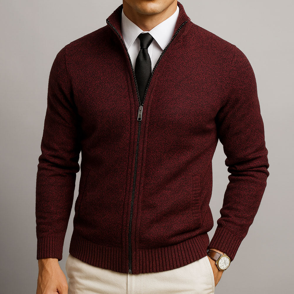 Burgundy textured zip-front cardigan with a structured collar, ribbed cuffs, and hem worn over a dress shirt and tie.